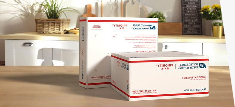 Two Priority Mail International® boxes sitting on a table.